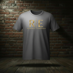 Rogue Standard Gold Tee in Ash on a ghost form against a dark brick wall and wood floor