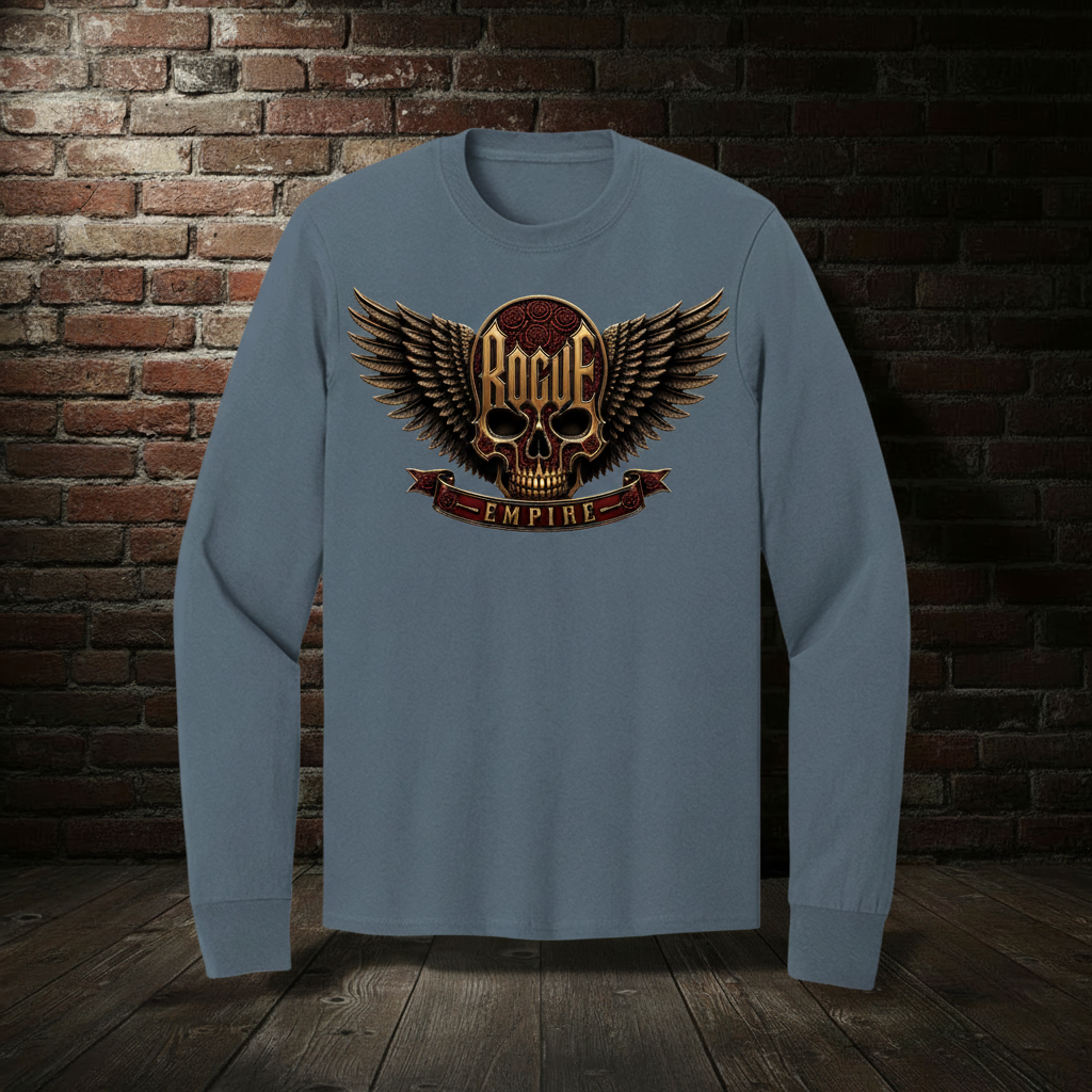 Rogue Empire Winged Skull Crest long sleeve tee in Steel Blue with boutique brick-wall background