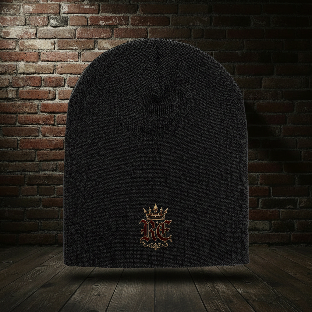 Black RE Crest knit hat on a dark red-and-black brick boutique background