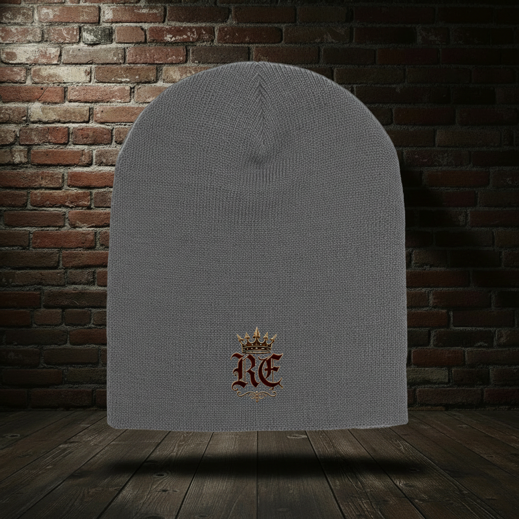 Charcoal RE Crest knit hat on a dark red-and-black brick boutique background