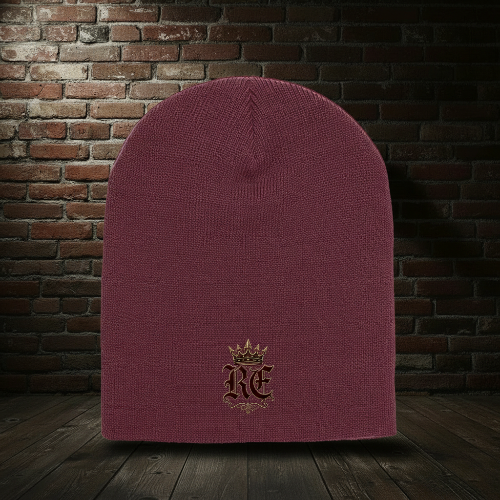 Maroon RE Crest knit hat on a dark red-and-black brick boutique background