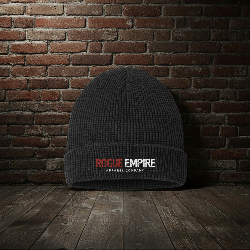 Manifest Destiny Waffle Cuffed Beanie in Black with boutique brick background