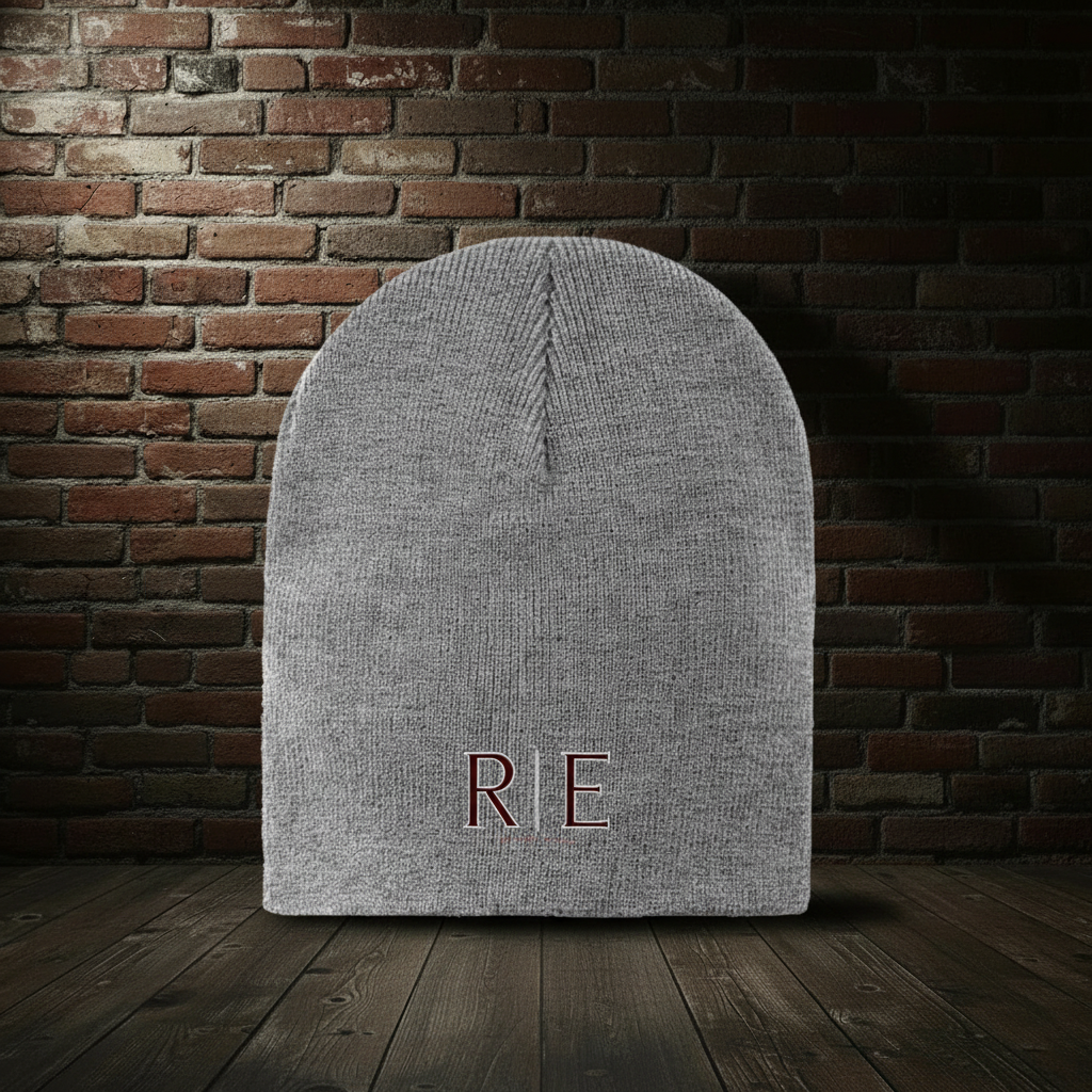 Athletic Oxford Founders II knit hat on a dark red-and-black brick boutique background